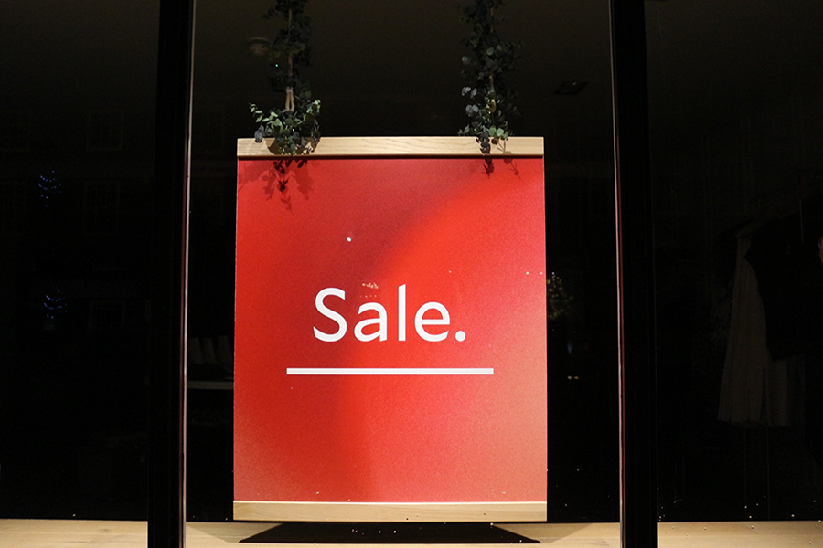 Sale sign in window to sell your business